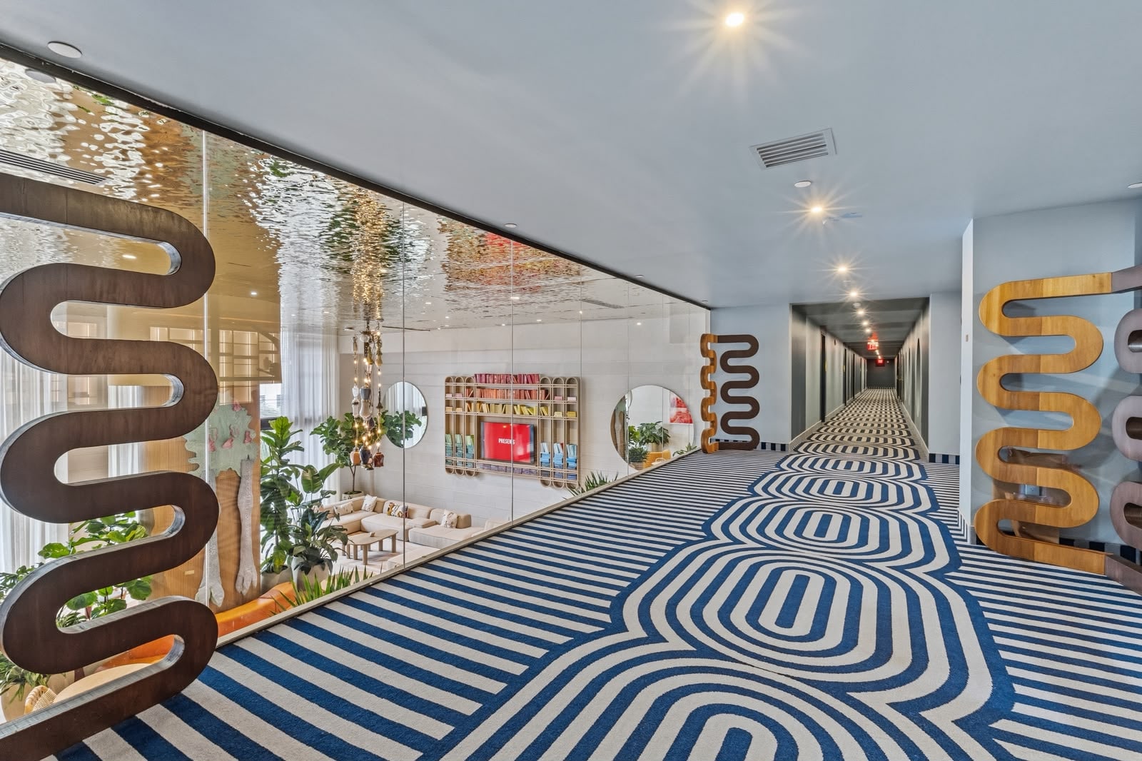 Residential corridor with sculptural wall art