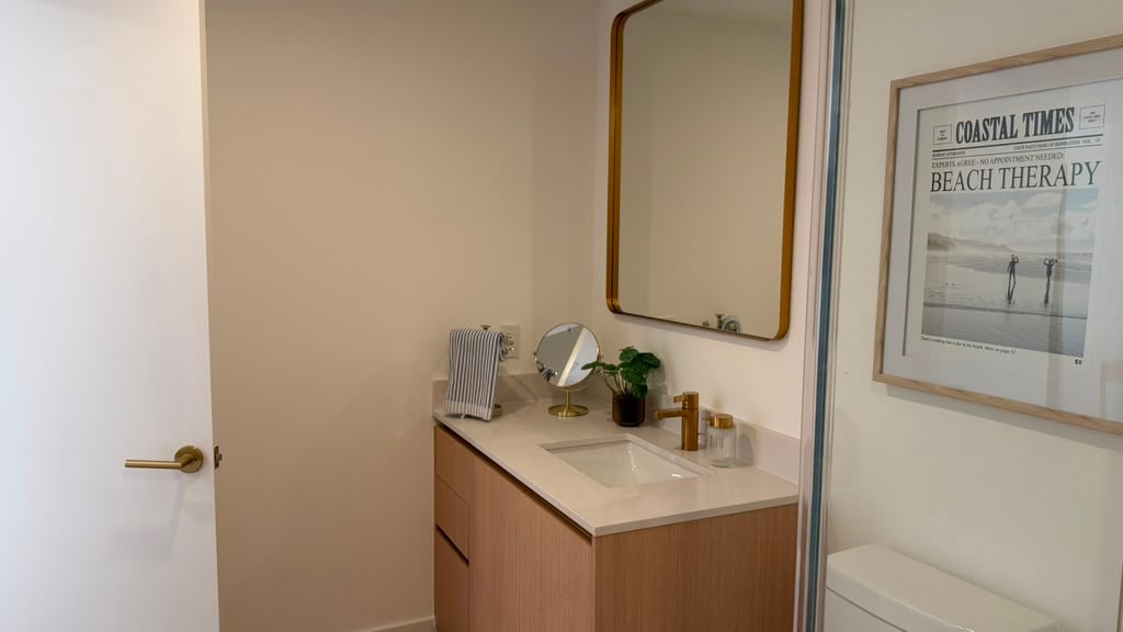 Bathroom vanity detail with framed art print