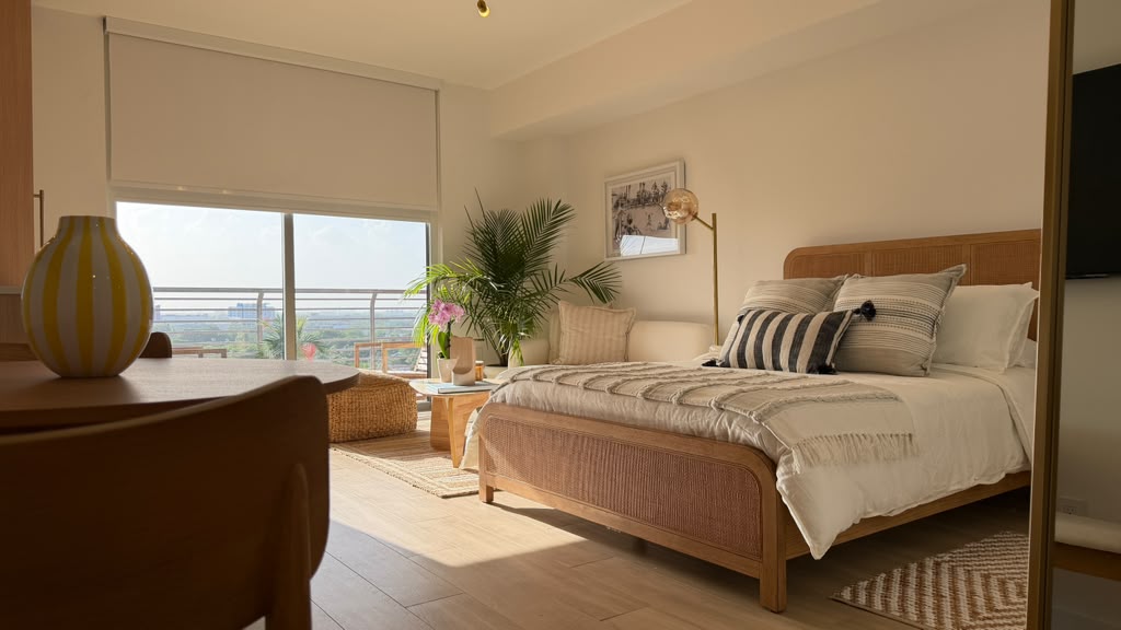 Bedroom with dining table and Midtown Miami view