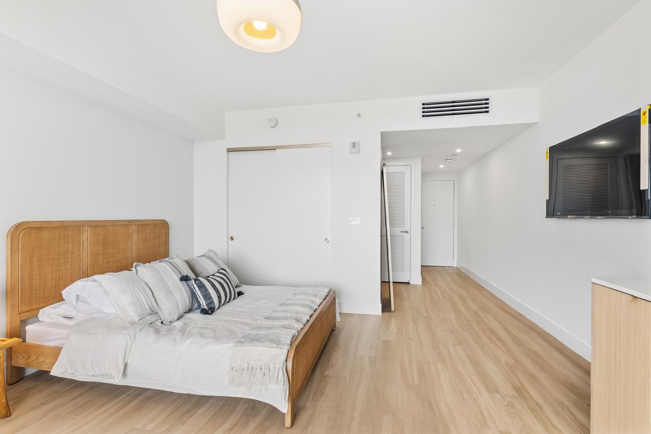 Bedroom area with closet and entry hallway
