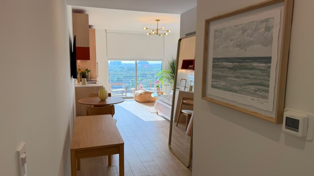 Entry hallway with framed coastal photography