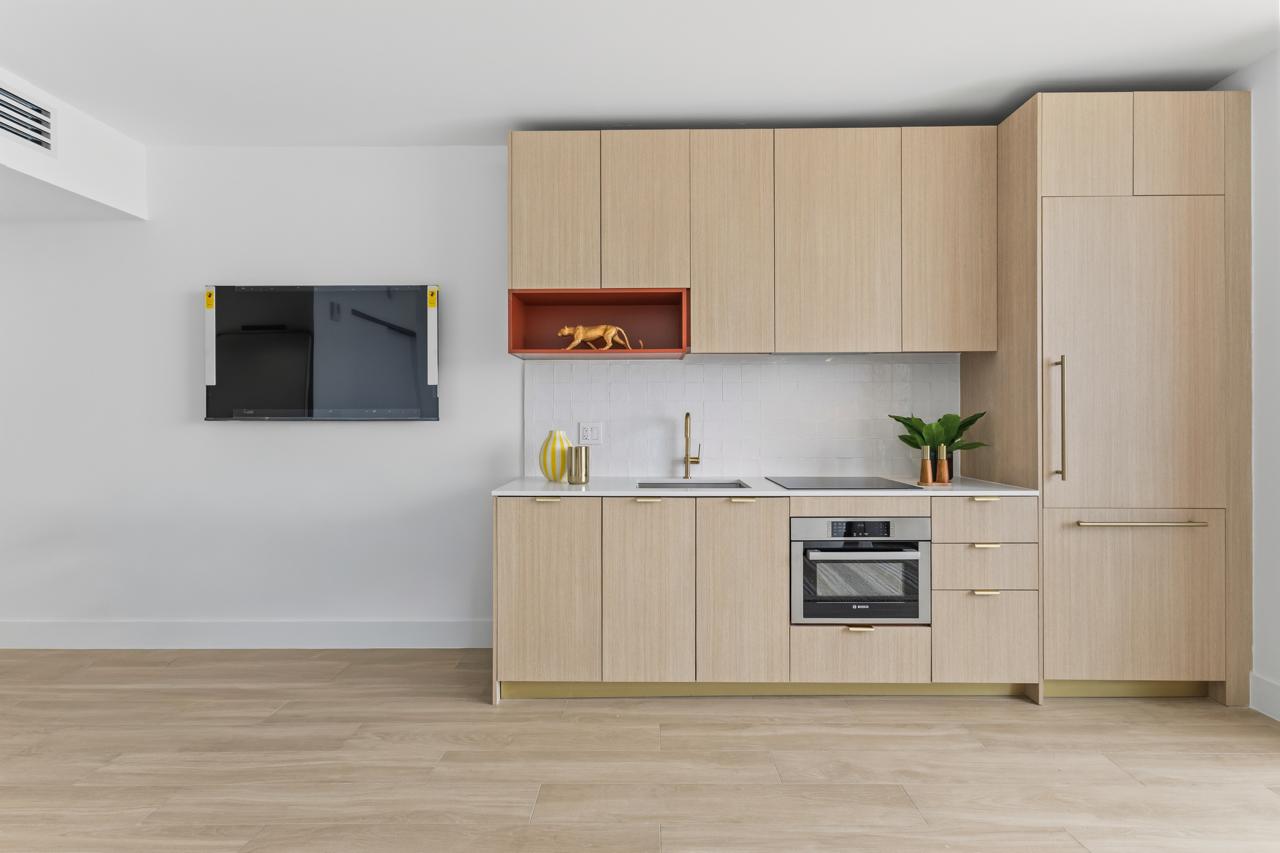 Kitchenette with built-in oven and cooktop