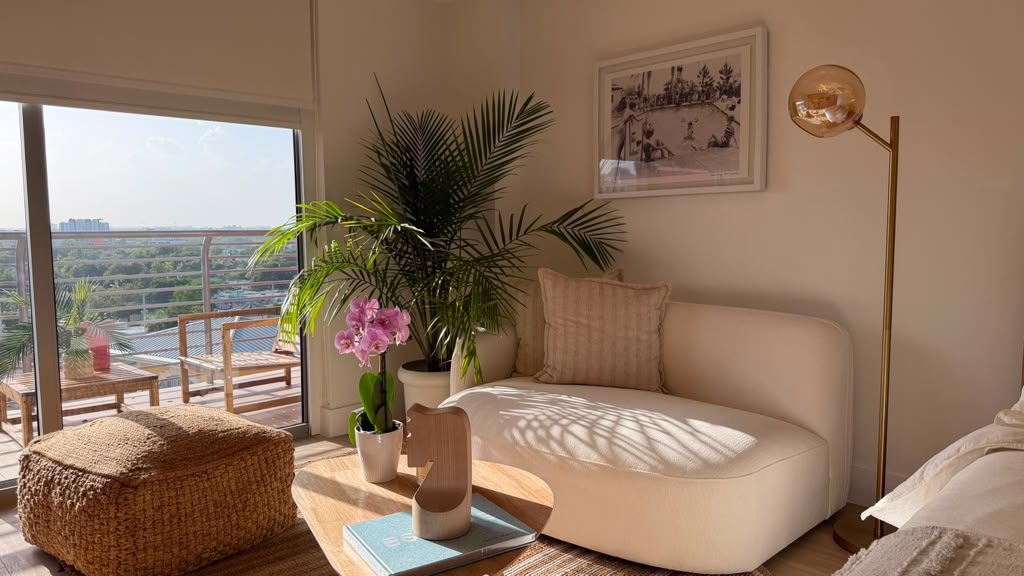 Living area with lounge chairs and Midtown Miami view