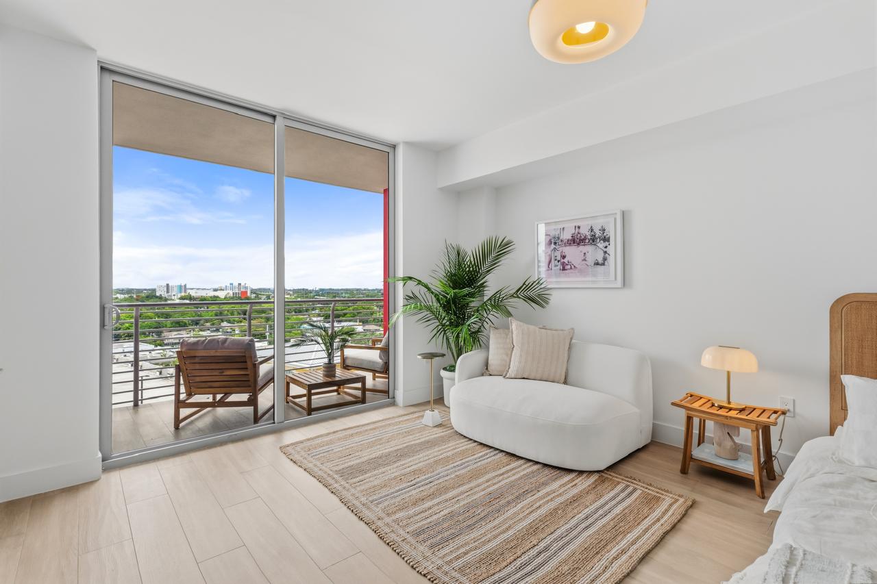 Studio living area with balcony access